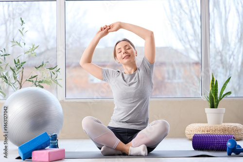 Young woman doing exercises...