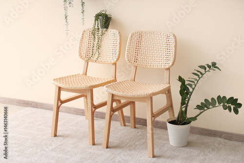 Two woven rattan dining cha...