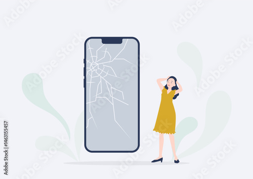 スマホの画面がバキバキに割れてショックを受ける若い女性