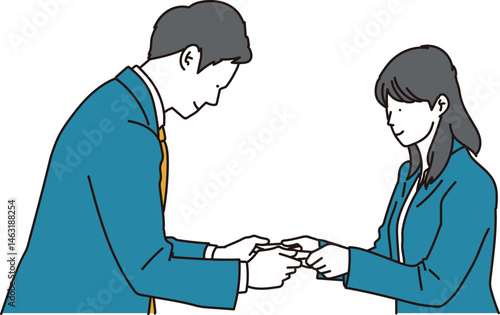 名刺交換をする男女のビジネスパーソン