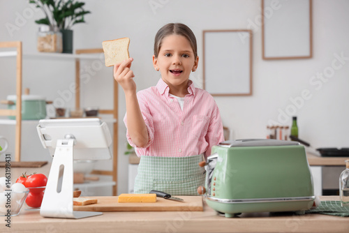 Cute girl with toast in kit...