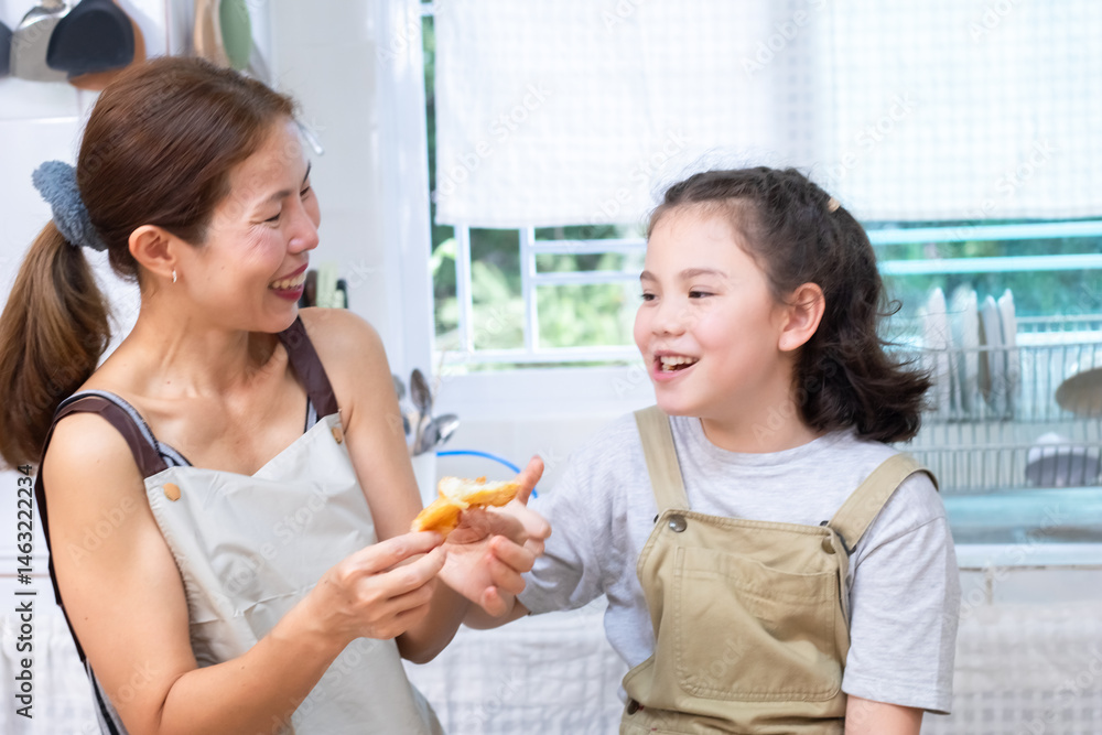 Smiling mother pouring orange juice into a glass for cheerful daughter, capturing family bonding and care, woman and child sharing a happy moment, happiness and warmth in kitchen atmosphere Smiling mother pouring orange juice into a glass for cheerful daughter, capturing family bonding and care, woman and child sharing a happy moment, happiness and warmth in kitchen atmosphere