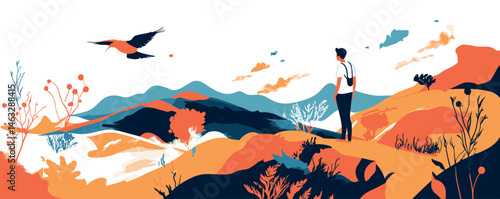 Young man hiking in colorful landscape watching flying bird under blue skies.