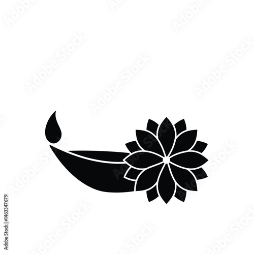 Black and white silhouette of a diwali diya oil lamp and a beautiful lotus flower decoration