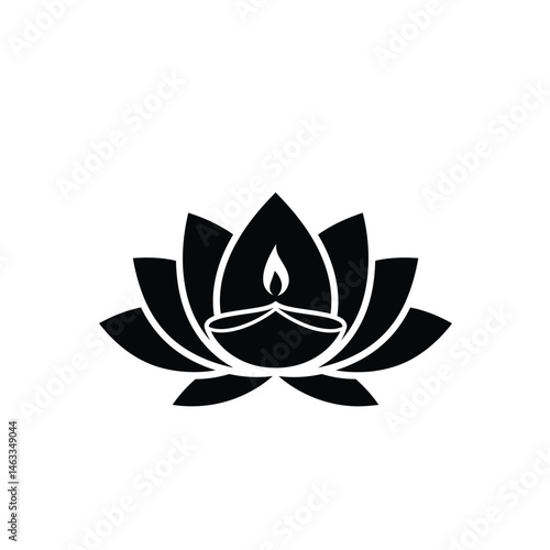 Black lotus flower with lit diya symbolic of diwali or religious enlightenment