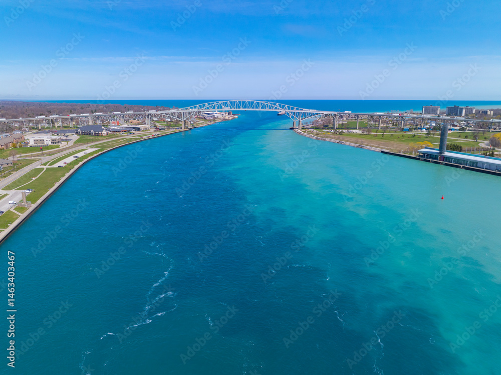 Fototapeta premium Blue Water Bridge is an international bridge across the St. Clair River links Port Huron, Michigan, USA (left) and Point Edward, Ontario, Canada (right). 