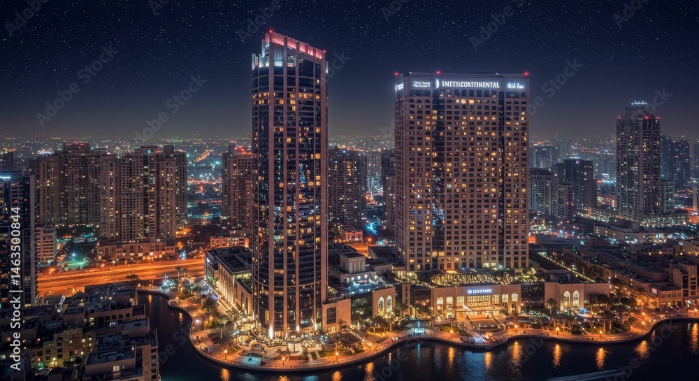 Fototapeta premium Night View of Modern City Skyline - Stunning nighttime cityscape showcasing illuminated skyscrapers and waterfront buildings. Perfect for travel, real estate, and urban projects