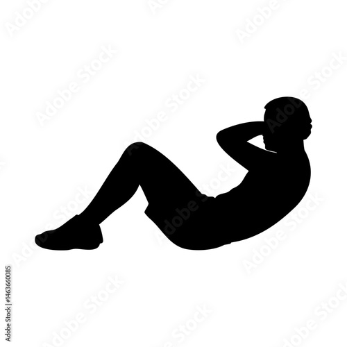 Silhouette of man doing abdominal sit-up workout