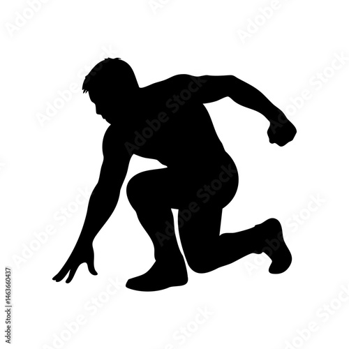 Silhouette of man crouching to ground