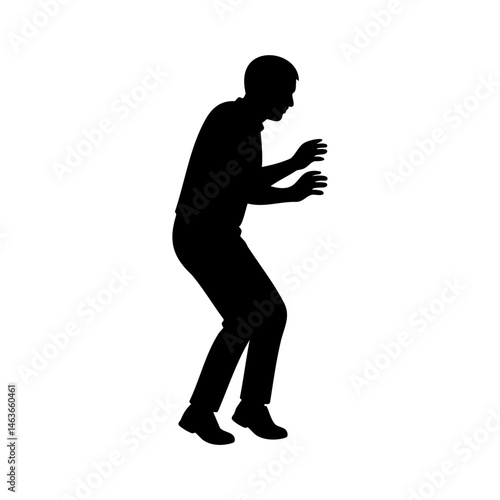 Silhouette of man in defensive posture