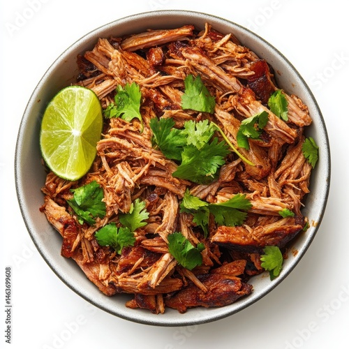 Pulled pork with lime and cilantro in bowl isolated on white background. culinary and recipe use cases.