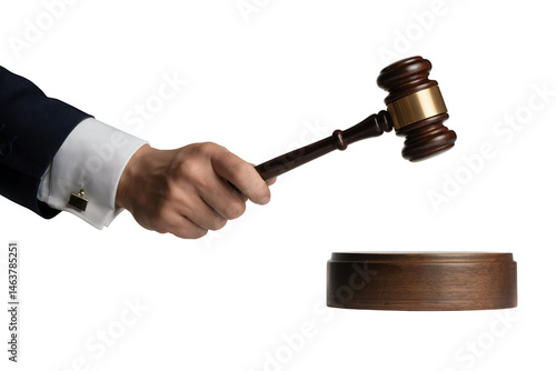 Close-up of a man's hand in a suit holding a judge's gavel about to strike a wooden block against transparent background, concept for law, justice, and auction