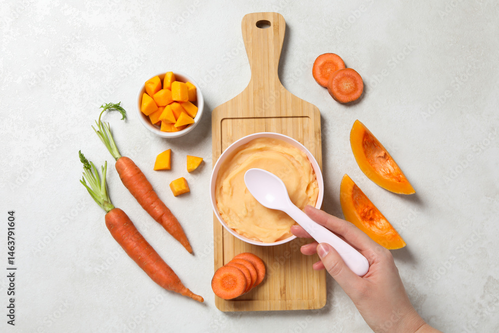 Children's vegetable and fruit puree, on a light background.