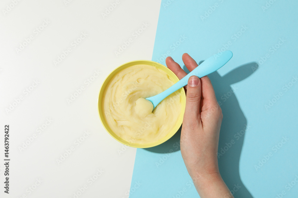 Children's puree from fruits and vegetables, on a blue background.