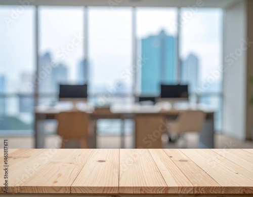 A wooden table in focus with a blurred modern office background, showcasing a cityscape through large windows, creating a professional ambiance
