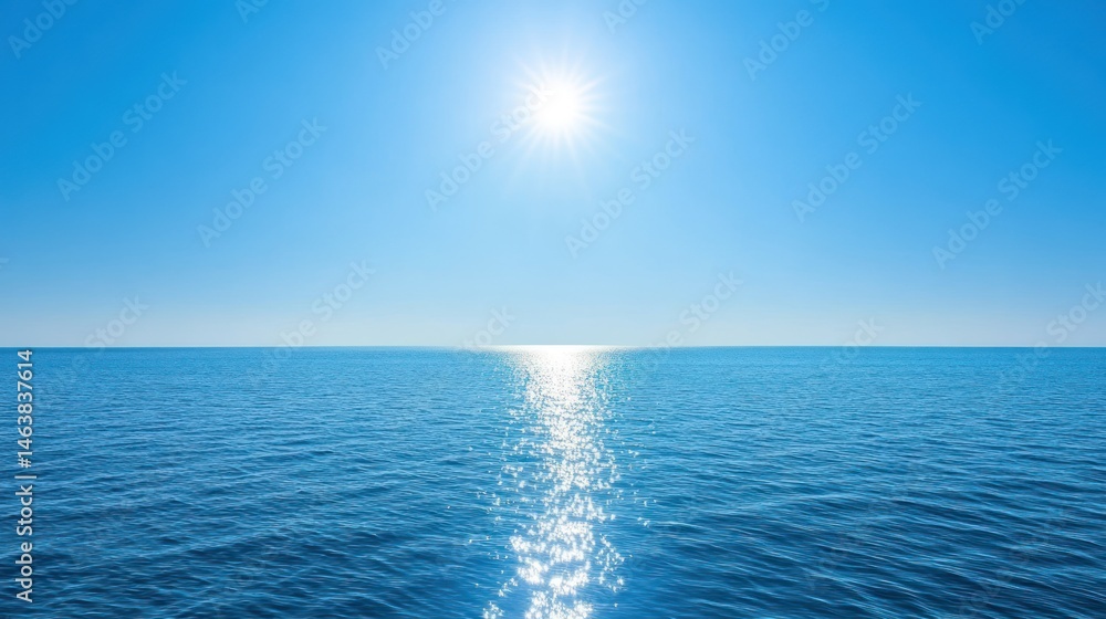 Obraz premium Calm blue ocean with sun reflection