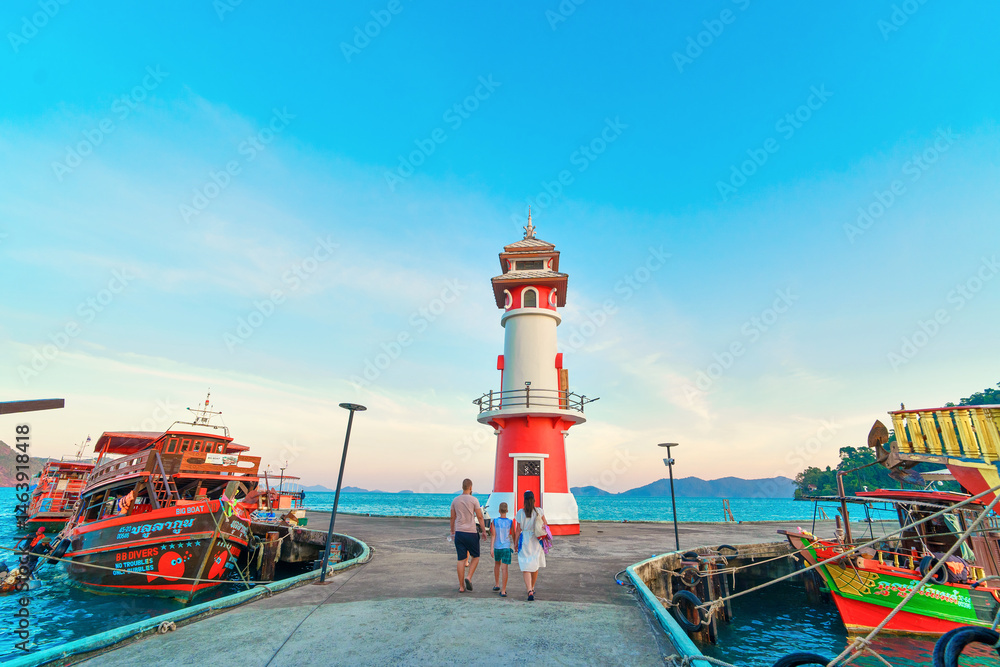 people walk on Bang Bao pier in Ko Chang island