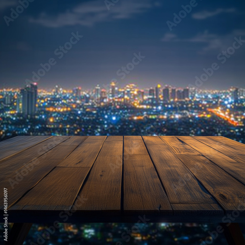 A wooden table in the foreground overlooks a vibrant city skyline at night, with dazzling lights illuminating tall buildings and a clear sky with a few clouds.