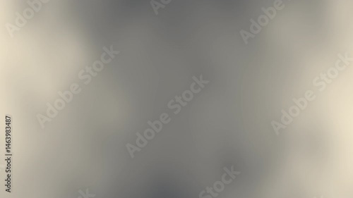 A soft, blurred abstract gray background with gentle gradient transitions and subtle lighting effects.