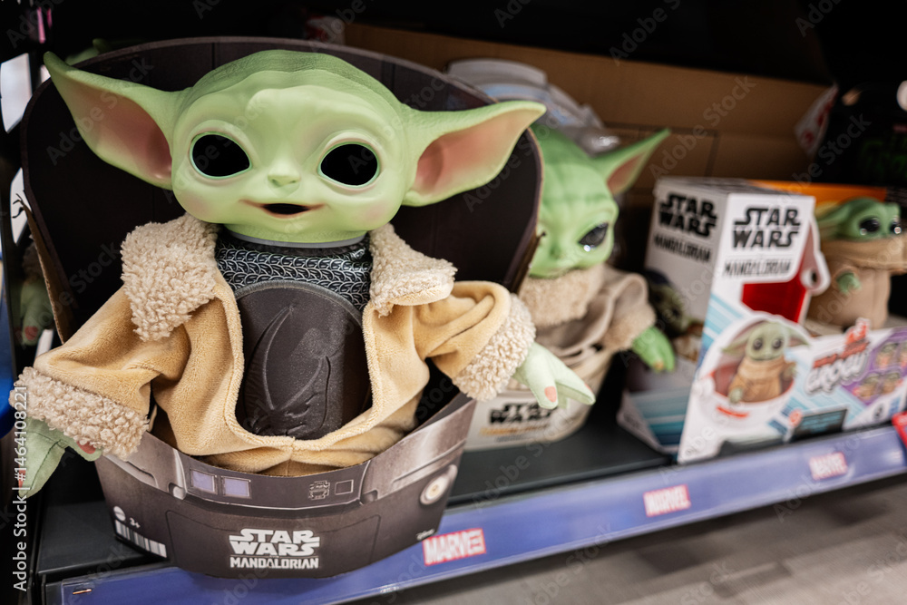 Naklejka premium Cute Mandalorian toy figure on store display showcasing popular merchandise for sale