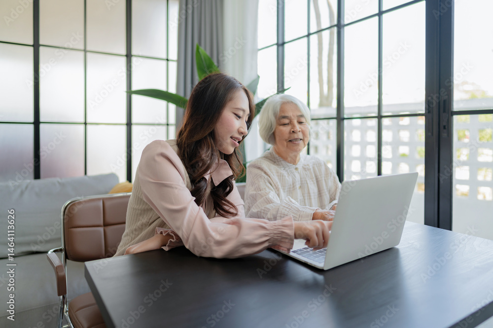 Granddaughter help her grandmother on digital device teaching digital skills. Granddaughter help her grandmother on digital device teaching digital skills.