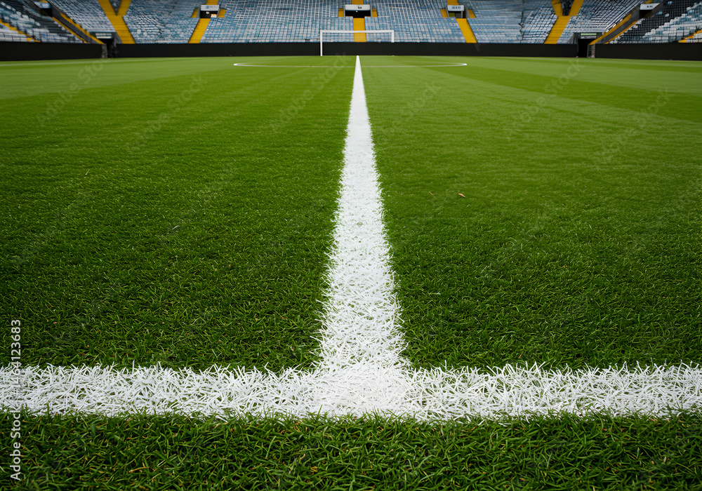 Vibrant Green Soccer Field with White Lines in an Empty Stadium