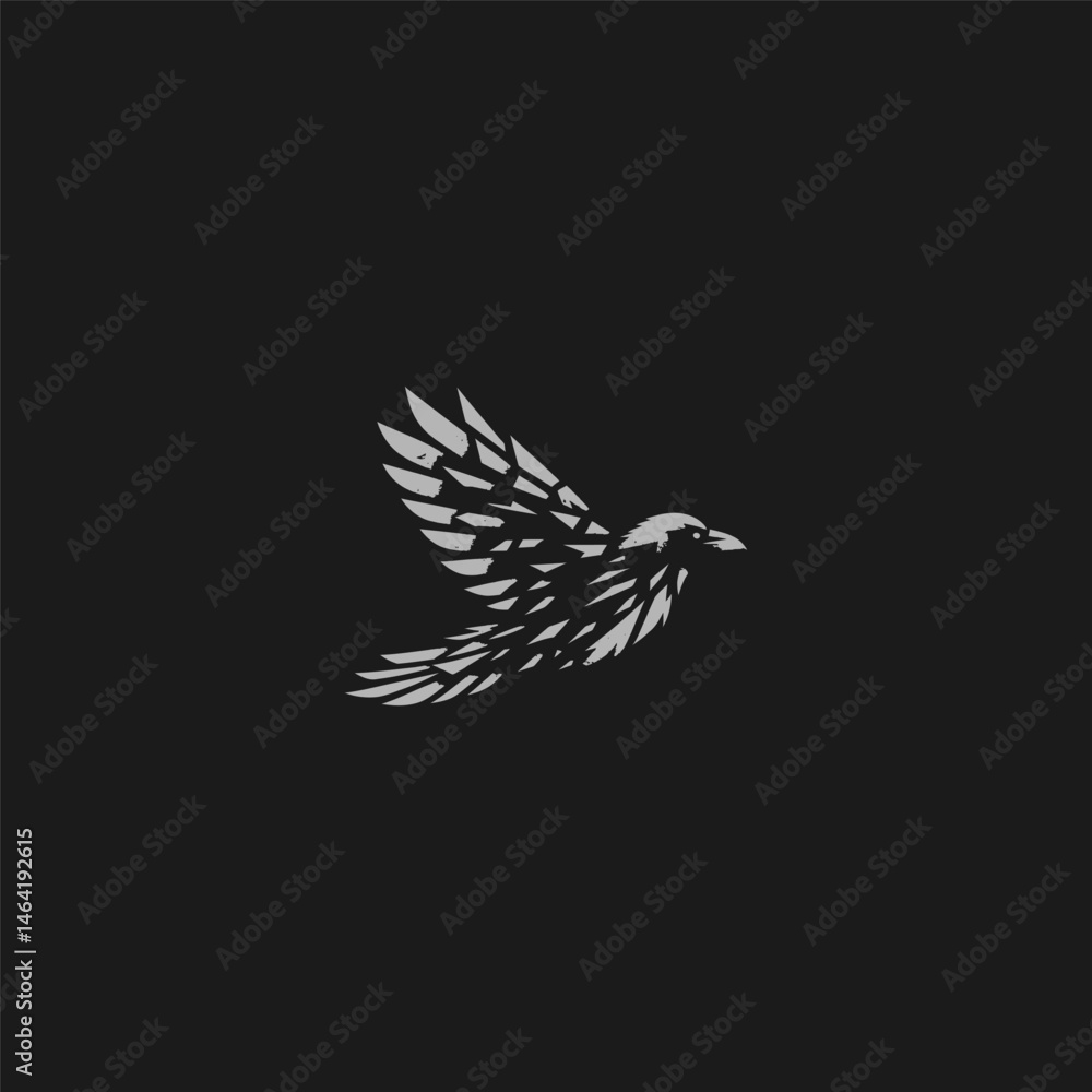 Obraz premium Flying crow logo with fragmented feather silhouette style.