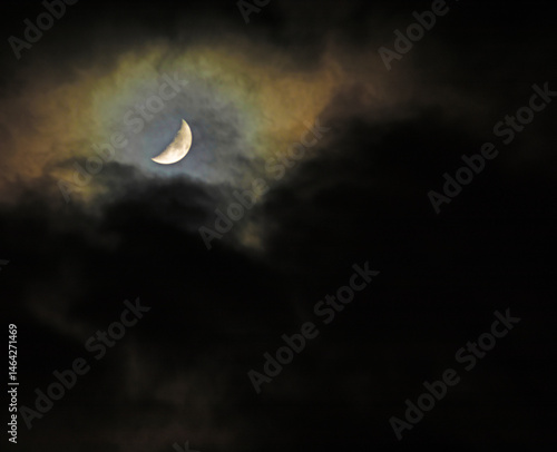 Obraz na płótnie Dark clouds about to obscrure the moon in the night w salonie
