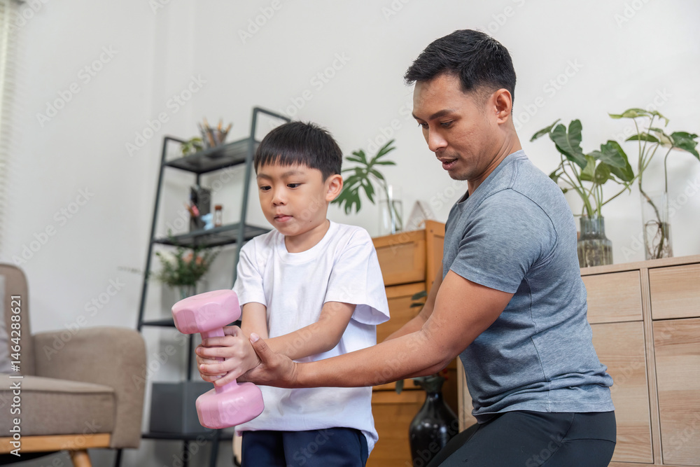 Obraz premium Family exercise session with father guiding son lifting weights