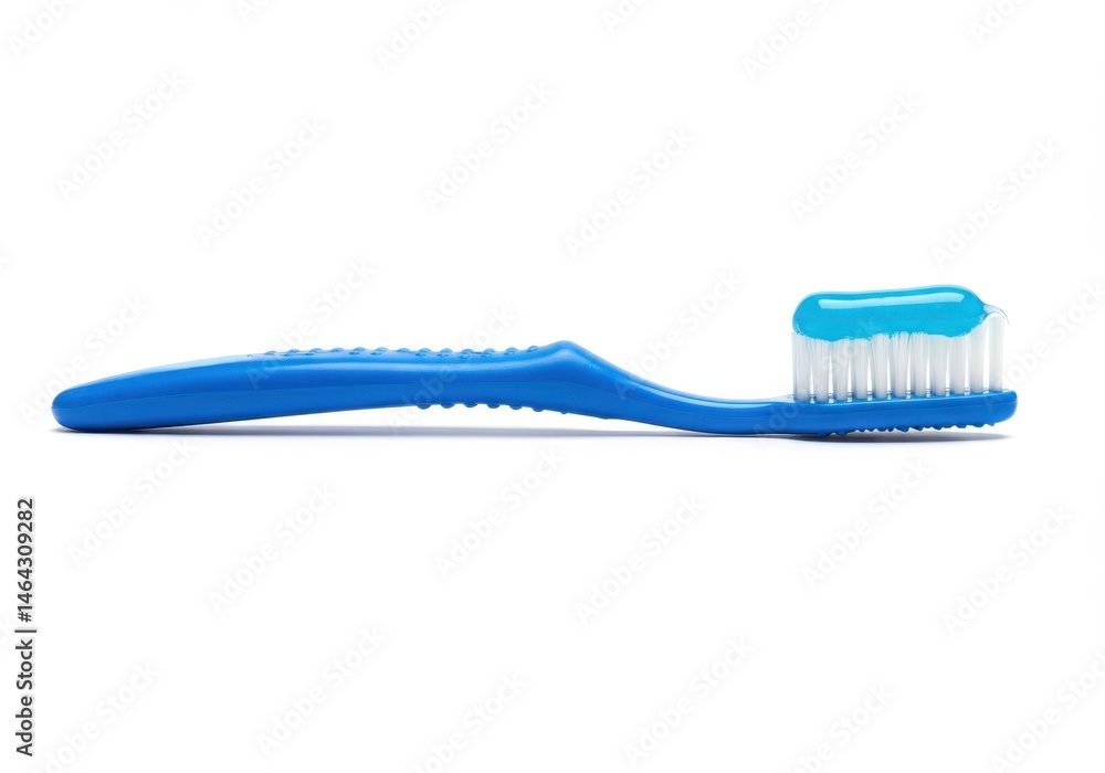 A blue toothbrush with white bristles and blue toothpaste sits on a white surface A blue toothbrush with white bristles and blue toothpaste sits on a white surface