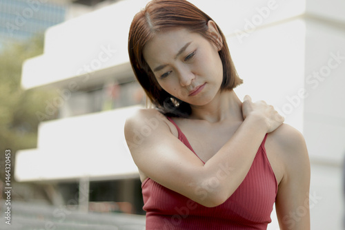 Short haired sporty woman in sportswear feels shoulder and neck pain, massages shoulder by hands while jogging work out on city street. Fitness female athlete suffering during exercise outdoor Free Download Short haired sporty woman in sportswear feels shoulder and neck pain, massages shoulder by hands while jogging work out on city street. Fitness female athlete suffering during exercise outdoor - GFXLoad