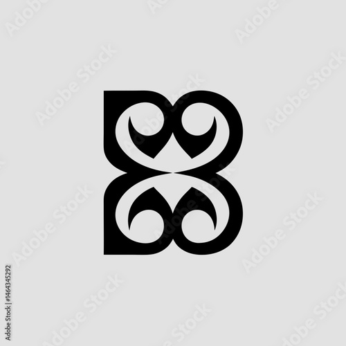 A complex tribal letter 'B' design in monochrome, using swirling, interconnected lines for a fierce, cultural appearance