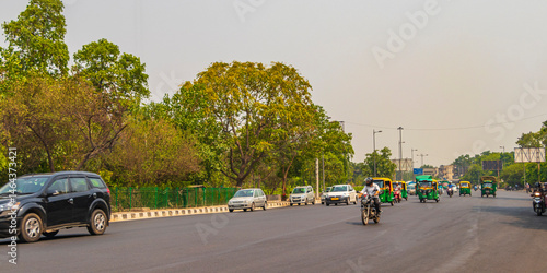 Big traffic Tuk Tuks buses people New-Delhi Delhi India.