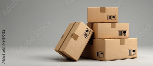 Obraz na płótnie Four cardboard boxes are stacked against a plain background, symbolizing shipping, packaging, and delivery logistics. w salonie