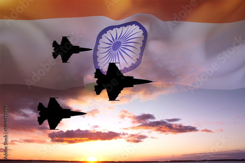 Obraz na plátne Silhouette of military aircraft against the sunset with India flag