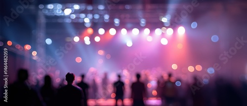 photo background of bokeh people in bright lights on stage where everyone is in the background and out of focus