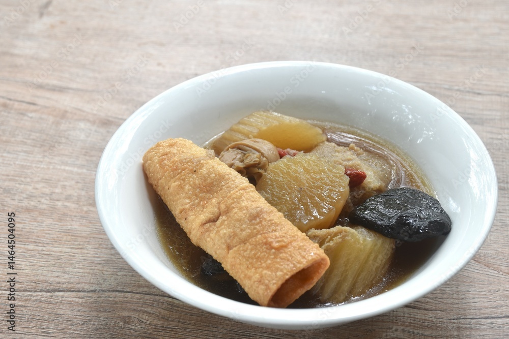 boiled slice radish with tofu and black mushroom soup vegetarian food on bowl