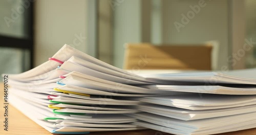 Paperwork organization stacking together on wooden table. Gathering corporate documentation in pile at clerk workplace. Business papers. Frame break