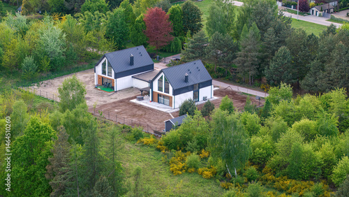 Modern Passive Semi-Detached House in Spring – Immersed in Fresh Greenery, Eco-Friendly Living, a contemporary semi-detached house designed for sustainable living, surrounded by lush spring.