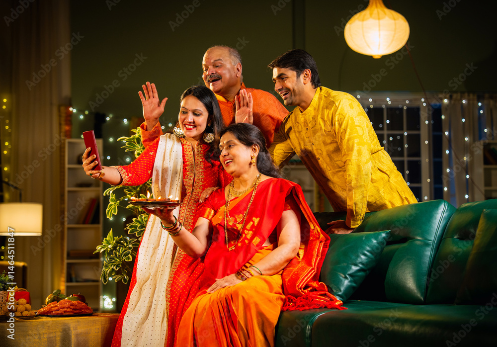 Fototapeta premium Smiling Indian family celebrating Diwali indoors with decorations enjoying festival moments together