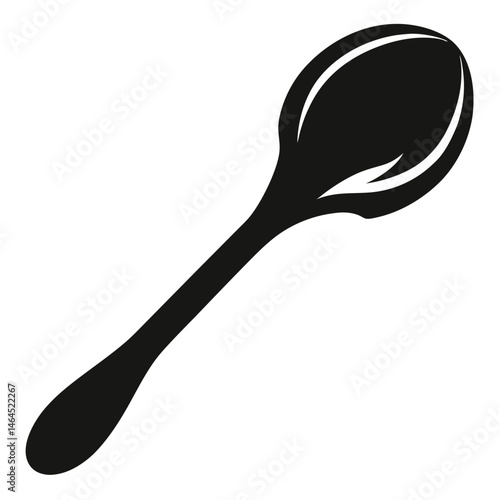 A sleek, simple black spoon angled against a clean white backdrop creates bold contrast