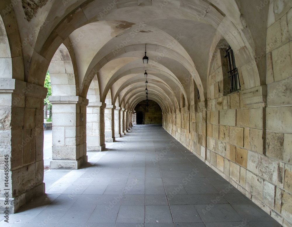Serene stone archway pathway. Ancient architecture, sunlight, shadows, peaceful atmosphere. Ideal for travel, architecture, and history projects. Serene stone archway pathway. Ancient architecture, sunlight, shadows, peaceful atmosphere. Ideal for travel, architecture, and history projects.