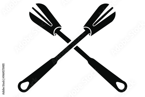 Two black barbecue forks are crossed, offering a simplistic kitchen utensil element