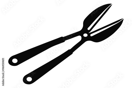 Black hedge shears show open blades ready to cut greenery in a garden