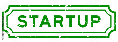 Grunge green startup word rubber seal stamp on white background