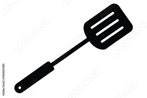 Single black spatula with slotted head presents a basic kitchen cooking utensil for recipes