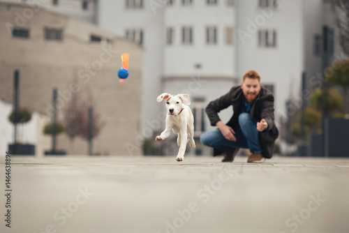 Wallpaper Mural Handsome young man spending time with his dog Torontodigital.ca
