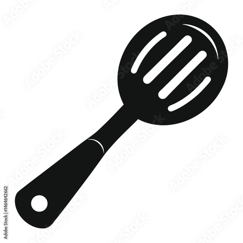 A monochrome slotted spoon showcases simplicity and utility for cooking applications is shown