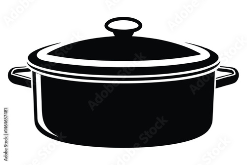 A black cooking pot with handles and a lid sits sealed tightly