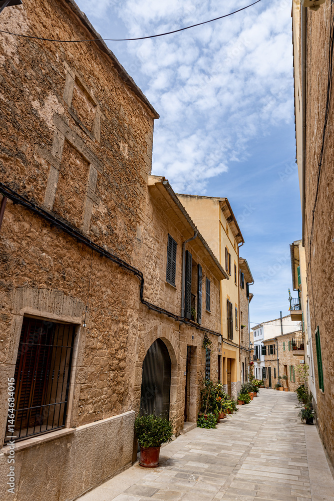 Fototapeta premium Alcudia is an ancient city on the island of Mallorca with a view of ancient walls, residential buildings